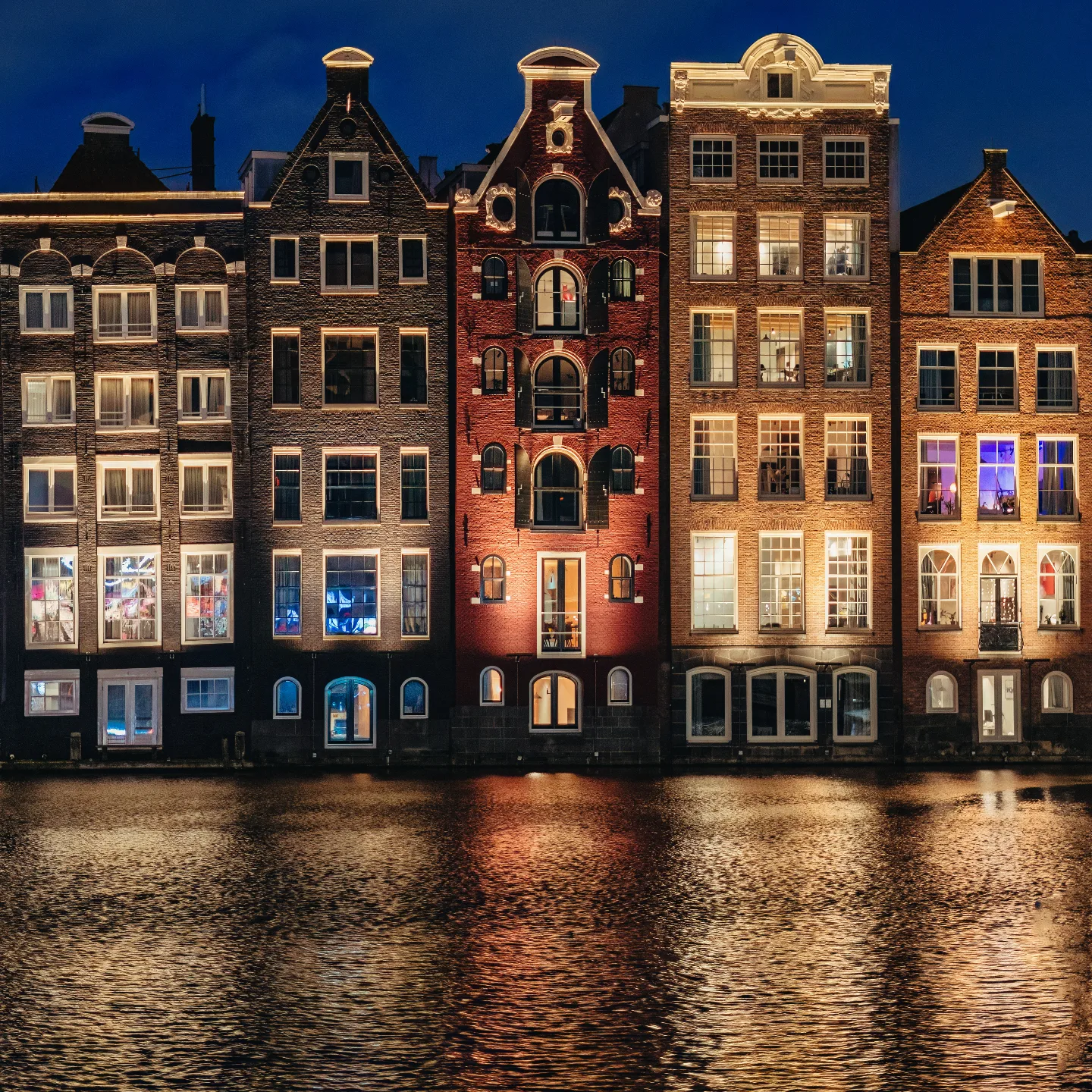 Amsterdam canal houses lit up at night