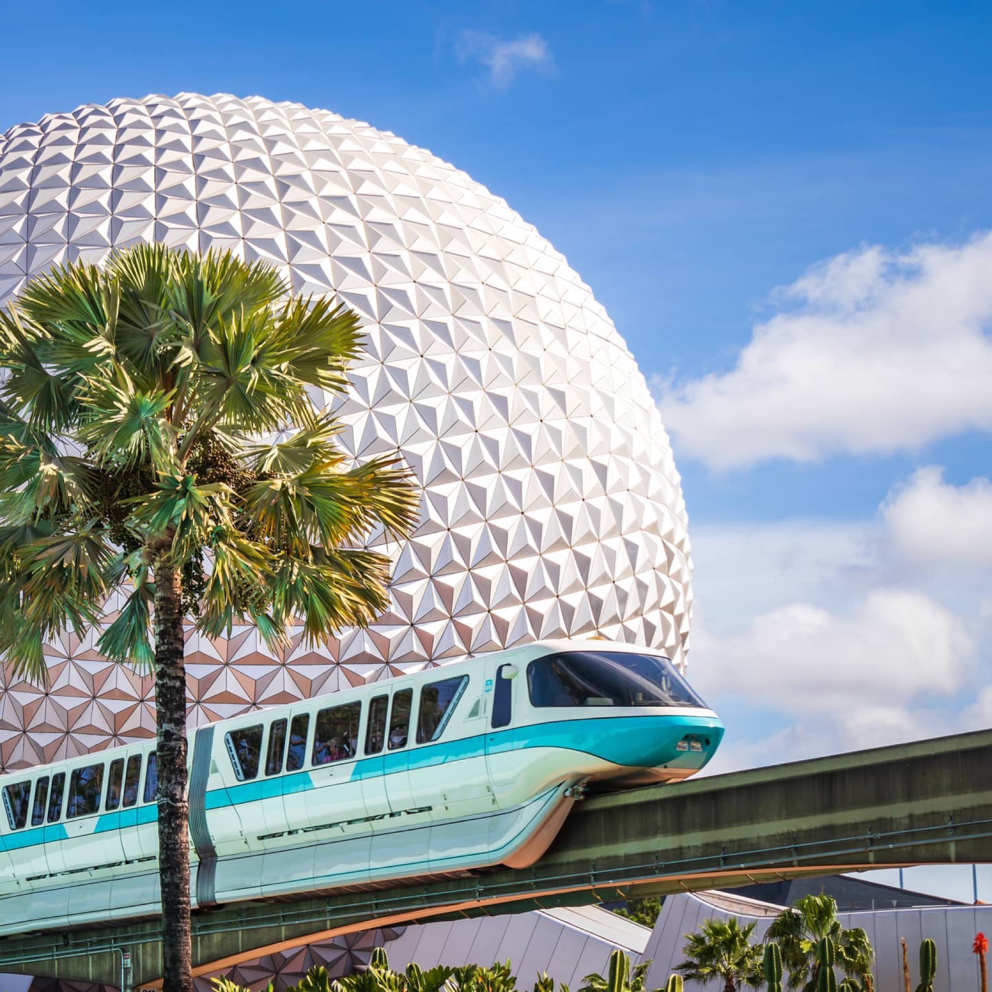 EPCOT Spaceship Earth geosphere with the teal monorail passing in front