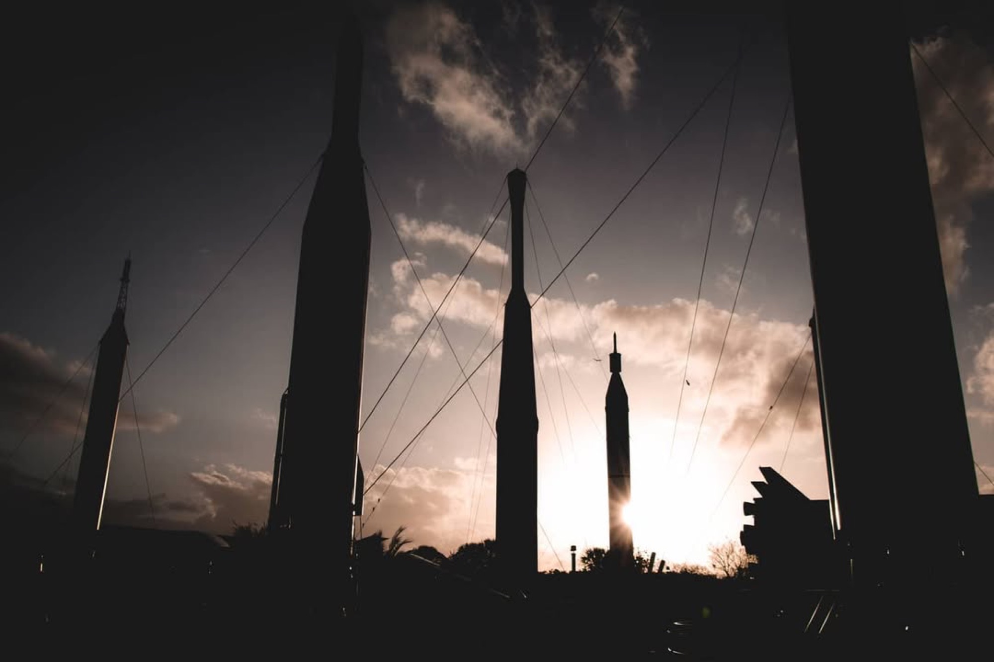 Silhouettes of rockets at sunset in the Kennedy Space Center Rocket Garden